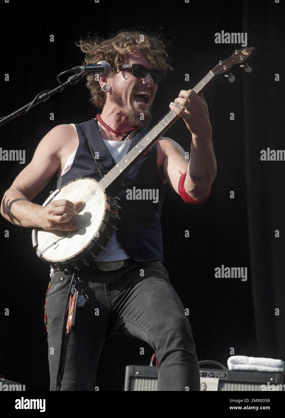 Australian musician John Butler sings and plays the guitar and bango ...