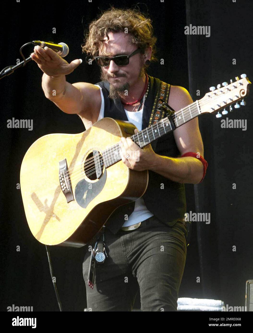 Australian musician John Butler sings and plays the guitar and bango ...