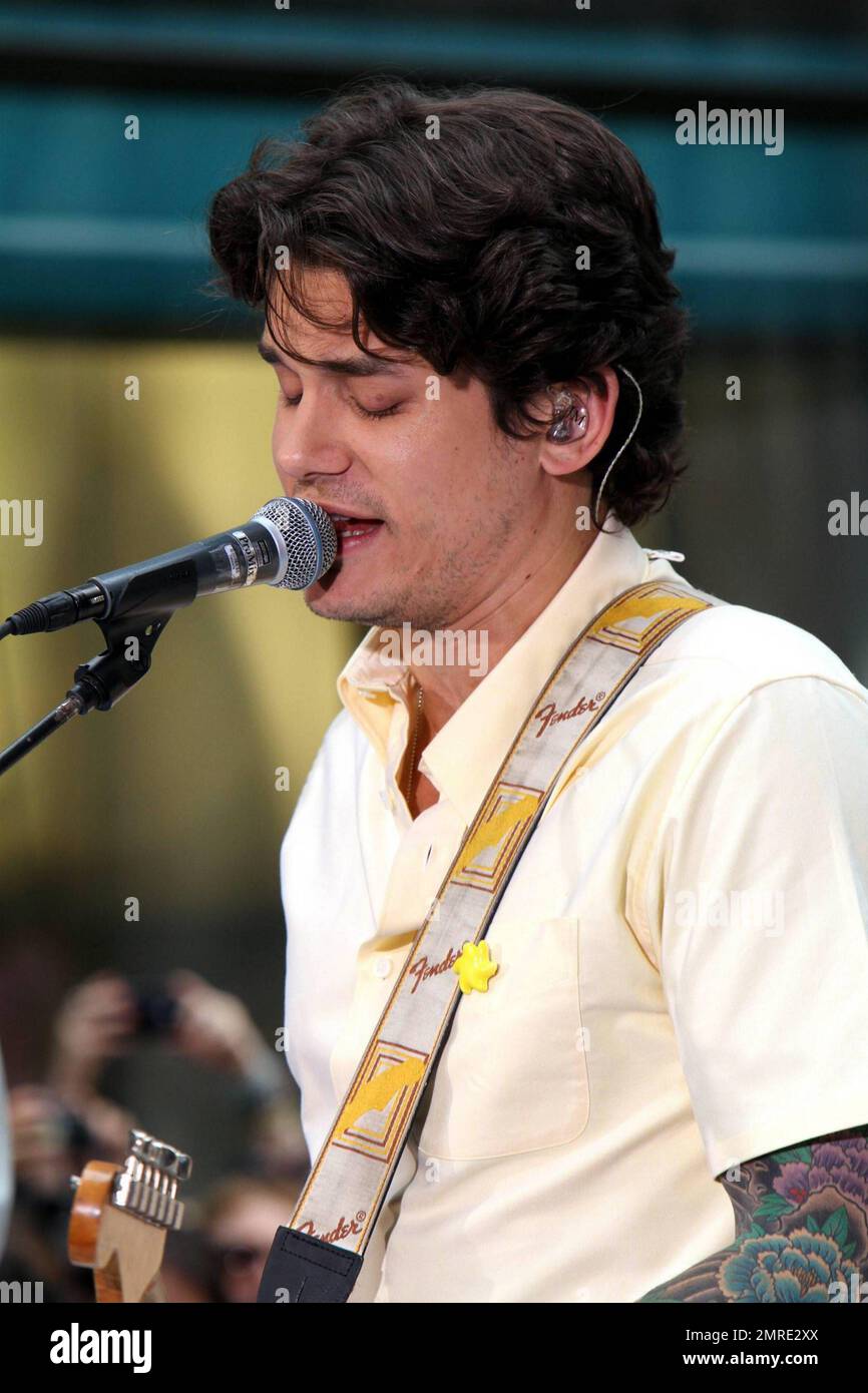 John Mayer looks dressed for summer in a pale yellow shirt and plaid ...