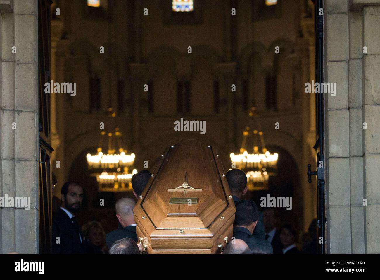 The coffin of Liliane Bettencourt is carried into the church in Neuilly