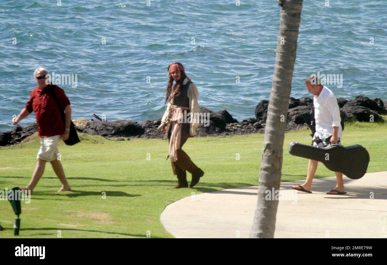 EXCLUSIVE!! Johnny Depp and Penelope Cruz leave their luxury hotel and board a yacht with film crew on their way to a deserted island to film the upcoming Disney sequel 'Pirates of the Caribbean: On Stranger Tides'.  Depp, in full Captain Jack Sparrow makeup and costume greeted Penelope and crew members with kisses.  Cruz, wearing a short white dress and black trousers showed a much fuller figure than normal amid pregnancy rumors.  In the fourth 'Pirates' installment, Captain Jack Sparrow  (Depp) crosses paths with Angelica, a woman from his past (Cruz), and he's not sure if it's love, or if s Stock Photo