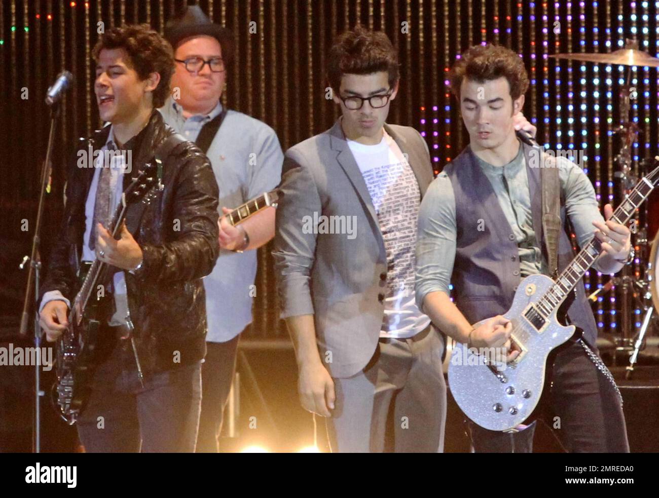 The Jonas Brothers, Joe, Kevin and Nick, perform on stage during the