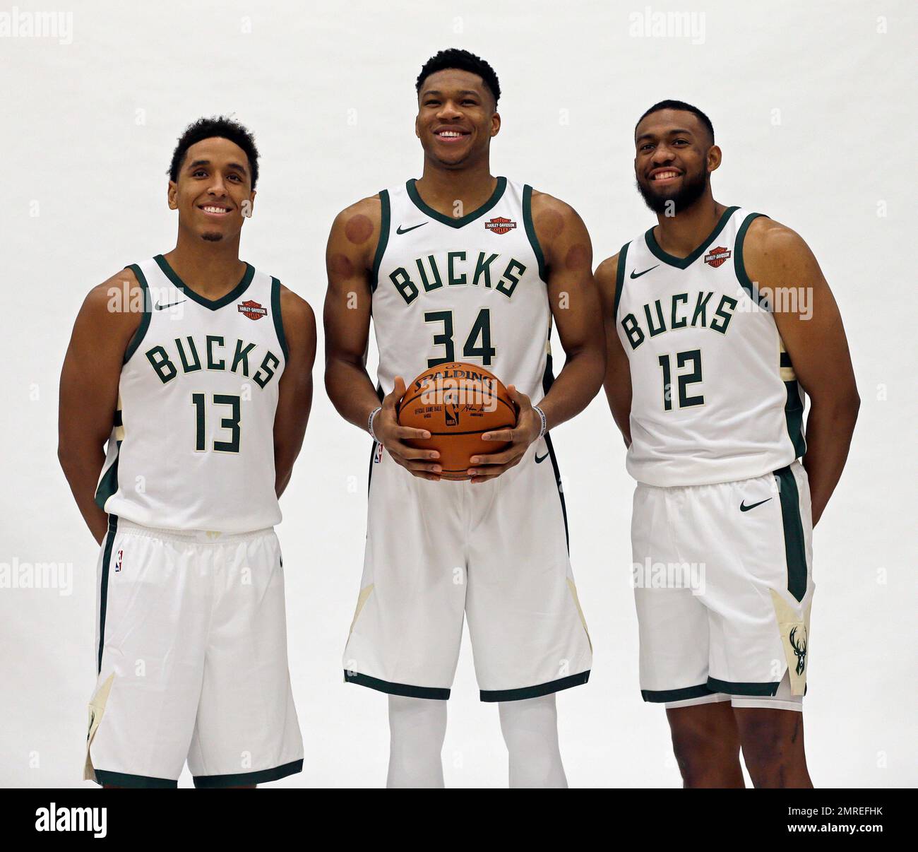 Milwaukee Bucks' Giannis Antetokounmpo (34), Malcolm Brogdon (13), and ...