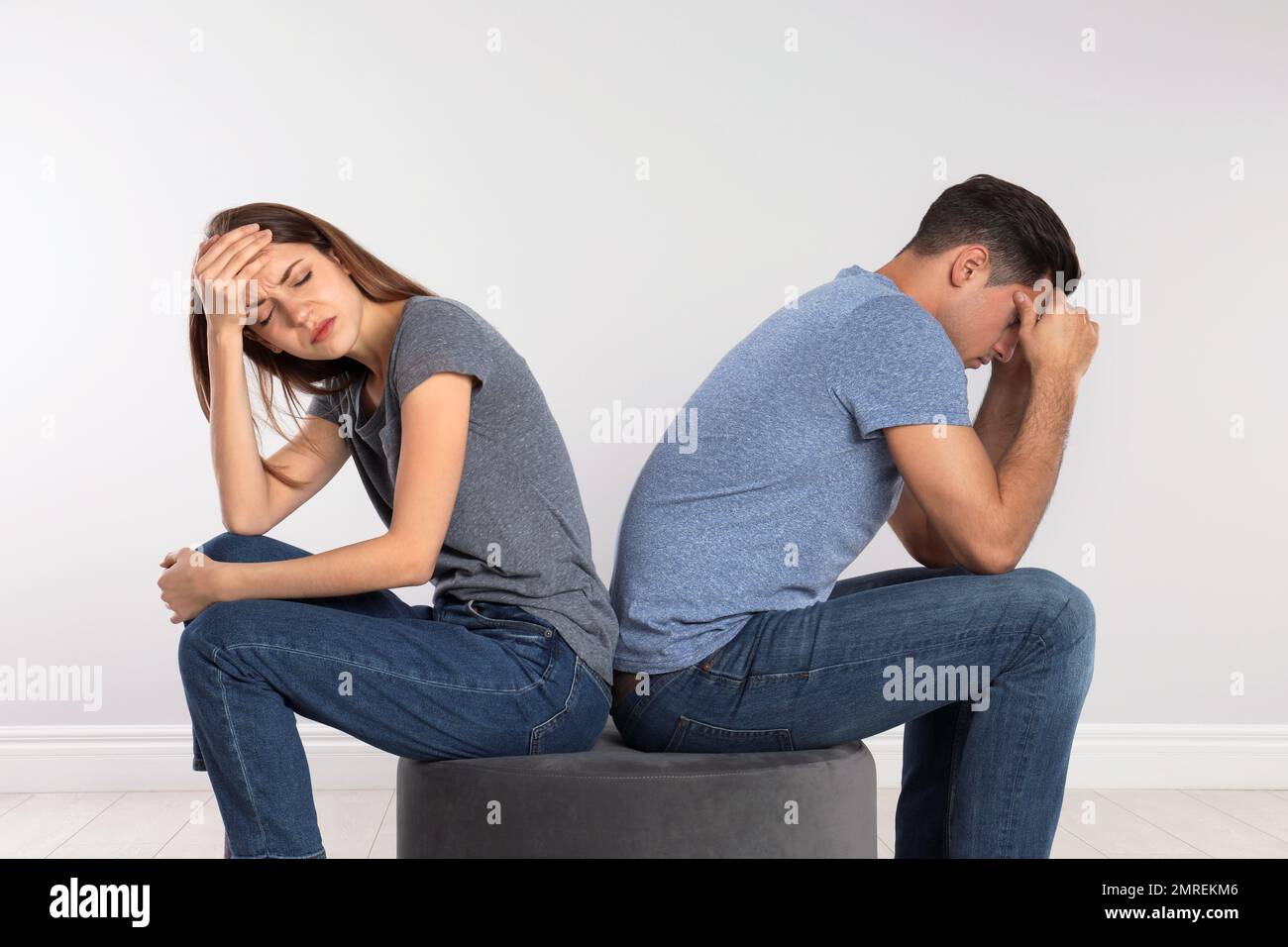 Couple with relationship problems on light background Stock Photo - Alamy