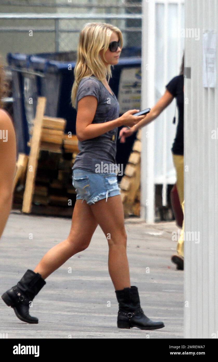 Julianne Hough wears a grey t shirt and denim short shorts as she checks  her cellphone before heading into a reading for the new movie "Rock of  Ages." Miami, FL. 5/12/11 Stock