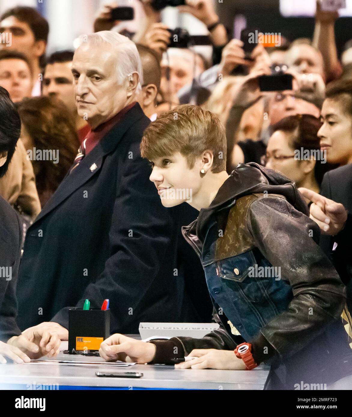 Justin Bieber wears a denim Louis Vuitton jacket as he makes a
