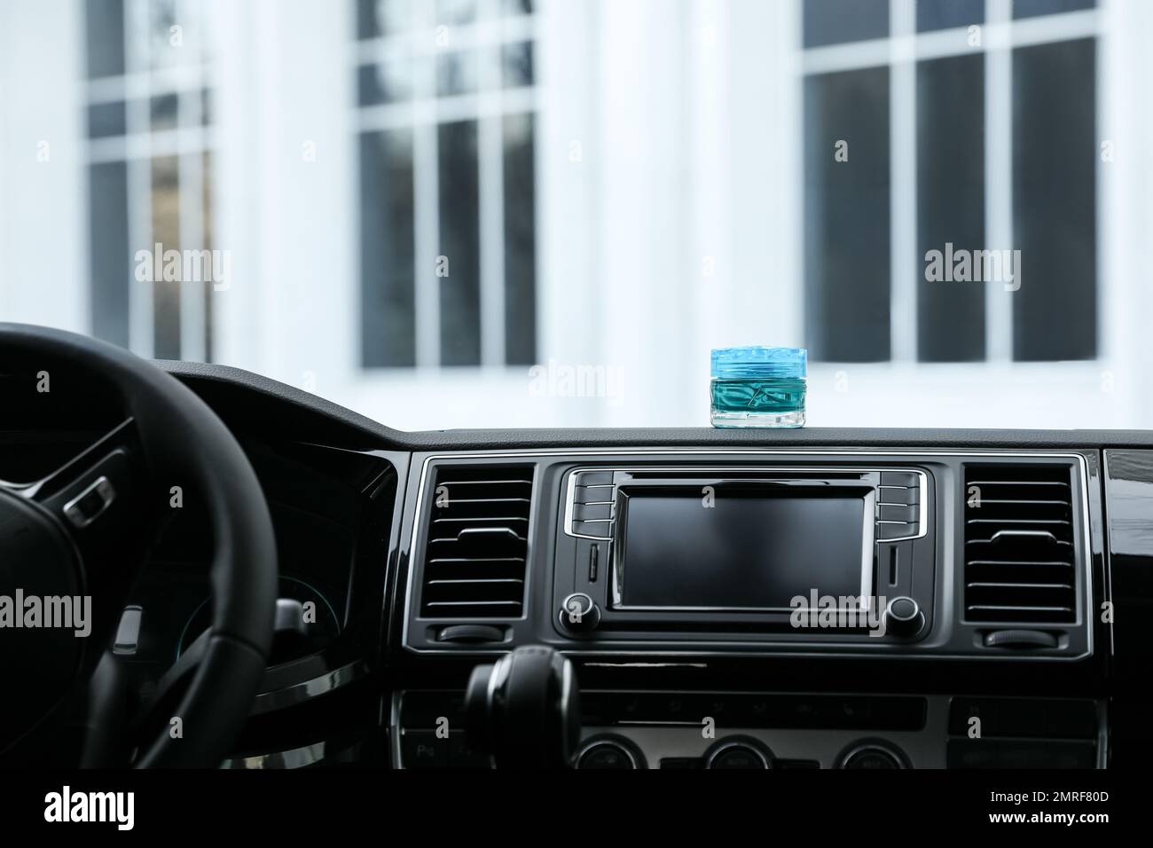Stylish air freshener on dashboard in car Stock Photo Alamy