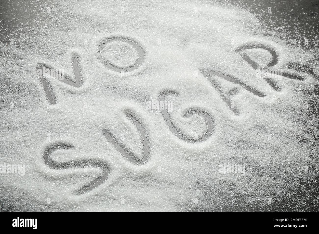 Composition with phrase NO SUGAR on grey table Stock Photo