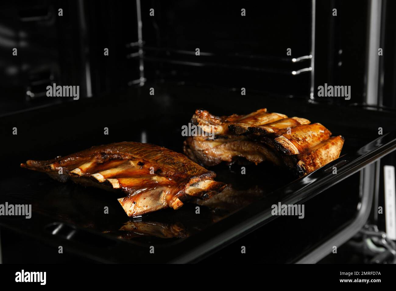 External Ribs On Sheet Delicious roasted ribs on baking sheet in oven Stock Photo - Alamy