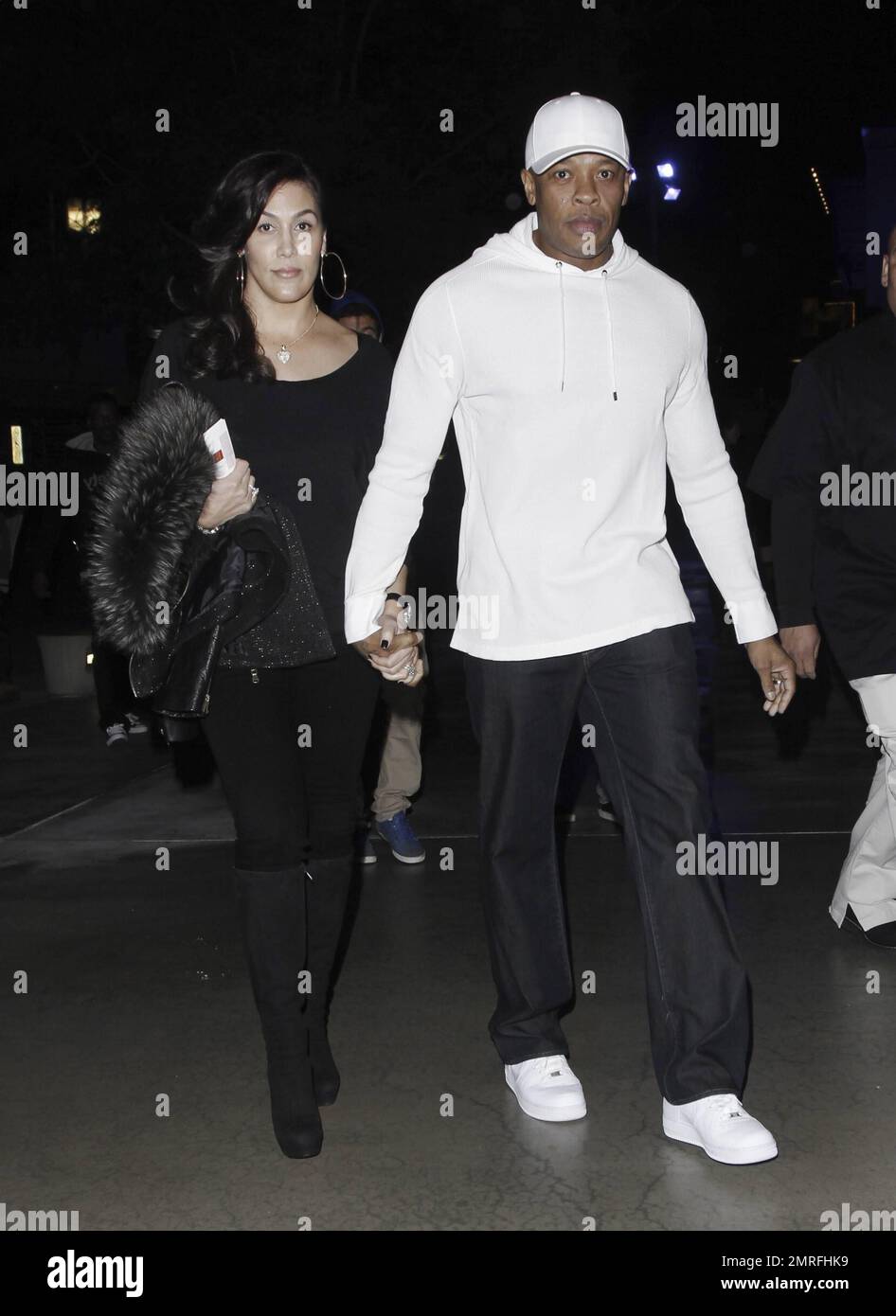 Rap music producer Dr. Dre and his wife Nicole Threatt Young arrive at ...