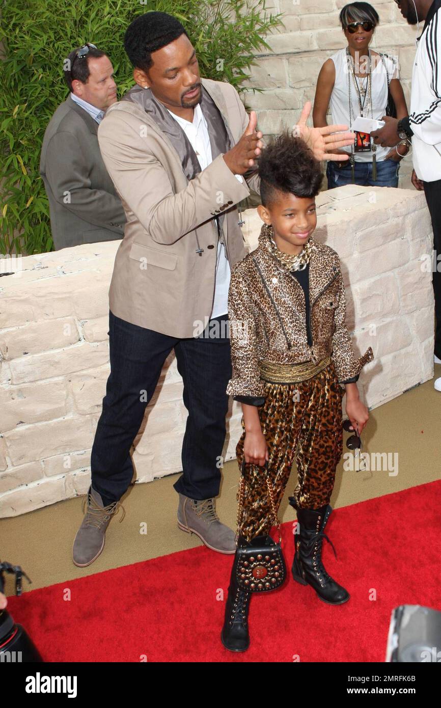Playful actor Will Smith jokes around with his super trendy daughter