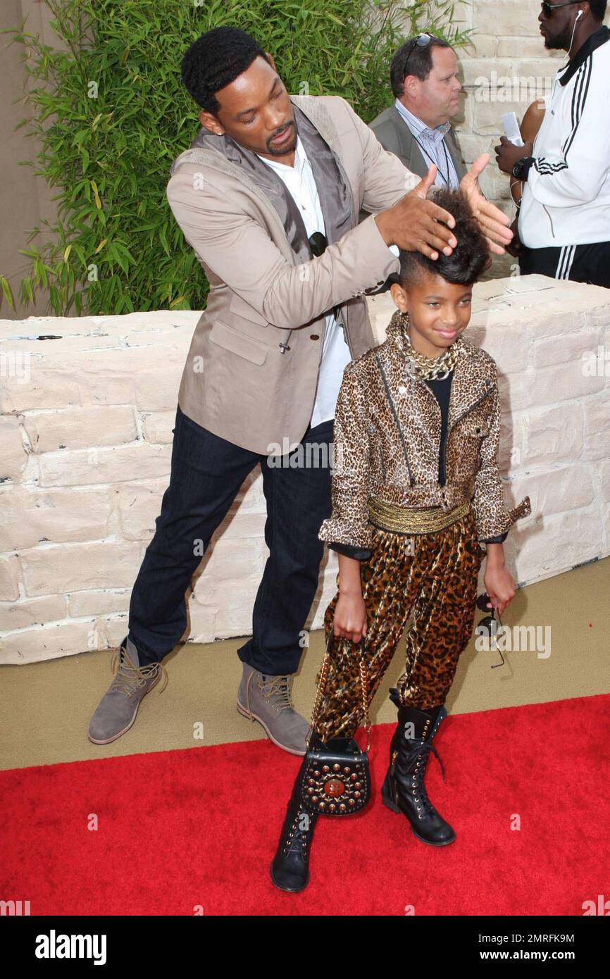 Playful actor Will Smith jokes around with his super trendy daughter