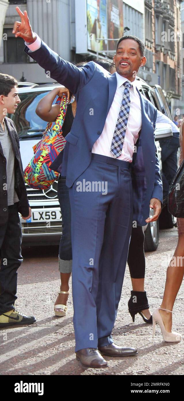 Will Smith flashes a peace sign to fans as he arrives for the UK premiere  of "The Karate Kid" held at Odeon Leicester Square. Young and fashionable  Jaden Smith, the star of