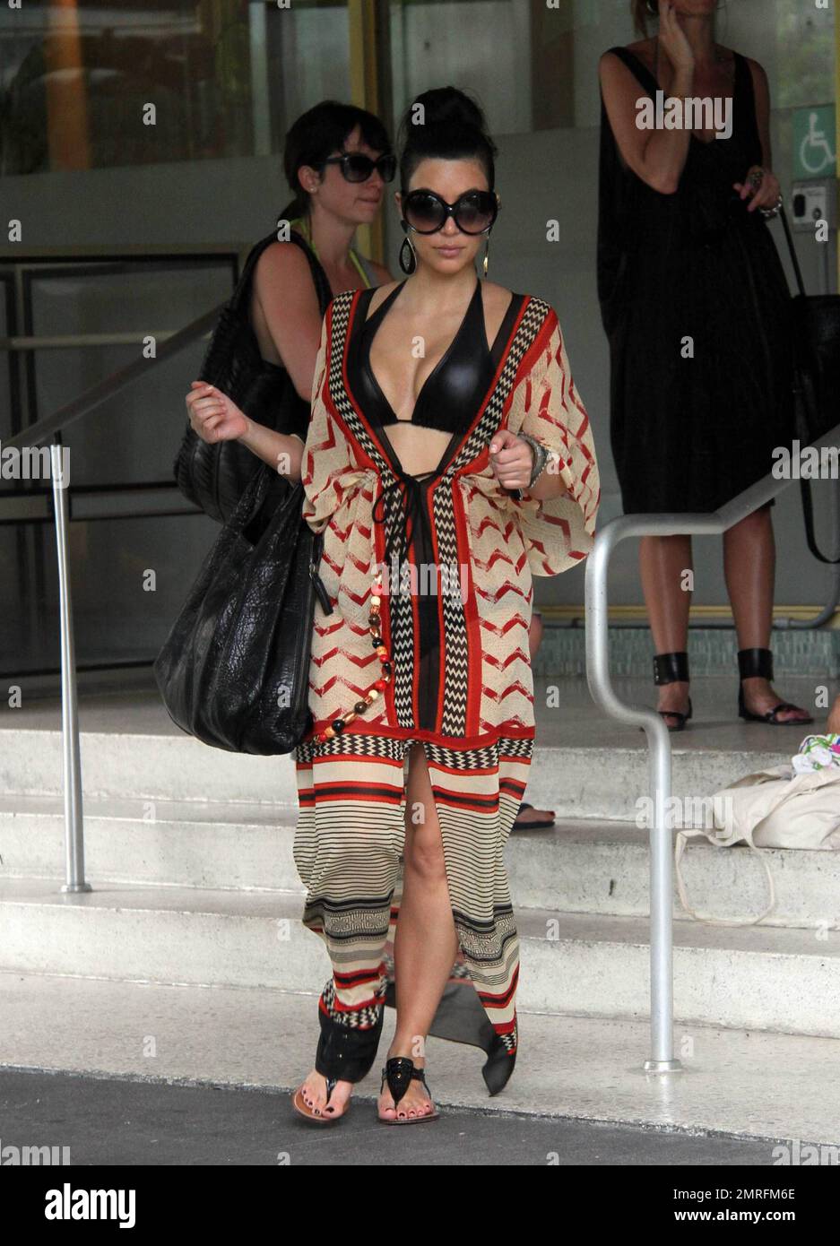 Kim Kardashian Wears Silky Golden Lanvin Boat-Neck Fitted Dress