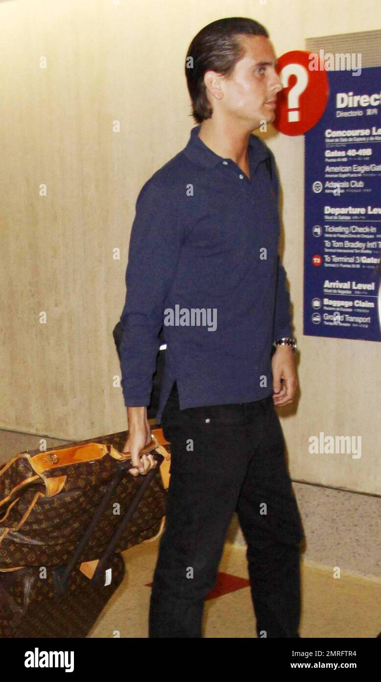 Scott Disick departing on a flight at LAX airport for Kim's