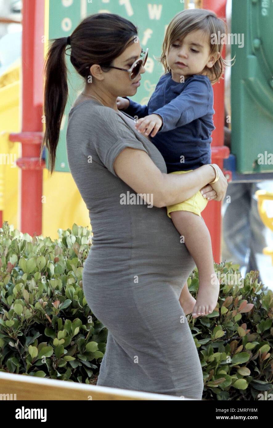 Reality star Kim Kardashian was seen out at the Malibu Country Mart with  her sister Kourtney Kardashian, who is pregnant with her second child, and  her son Mason. The Kardashian sisters took, image size:886x1390