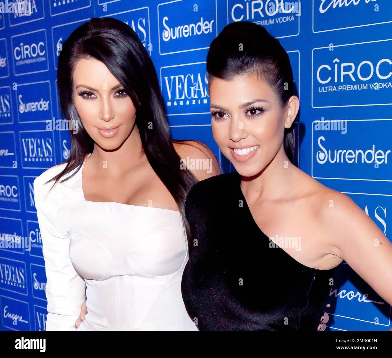 Sultry sisters and reality TV stars Kim and Kourtney Kardashian arrive at  Surrender Nightclub at Encore to celebrate Vegas Magazine's 7th  anniversary. The sisters donned similar one-sleeve dresses, Kim in white  and Kourtney in black velvet. As Kim made ...