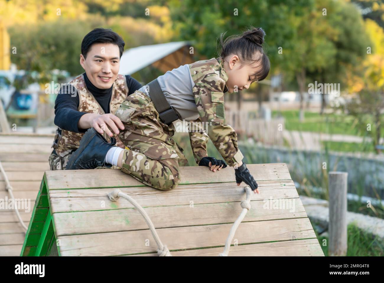 The father took his daughter to play cs Stock Photo