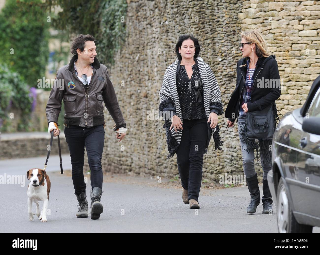 Kate Moss and jamie Hince are seen in the Cotswolds in Oxfordshire where they took their dog for a walk. Kate then drove her friend in her vintage Porsche, a present from Sir Phillip Green, to the pub, followed by husband Jamie in their silver Rolls Royce. London, UK. 12th April 2014. Stock Photo