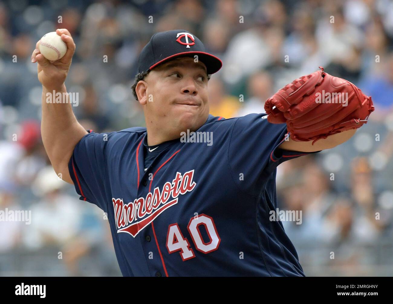 Minnesota Twins pitcher Bartolo Colon delivers the ball to the New York ...