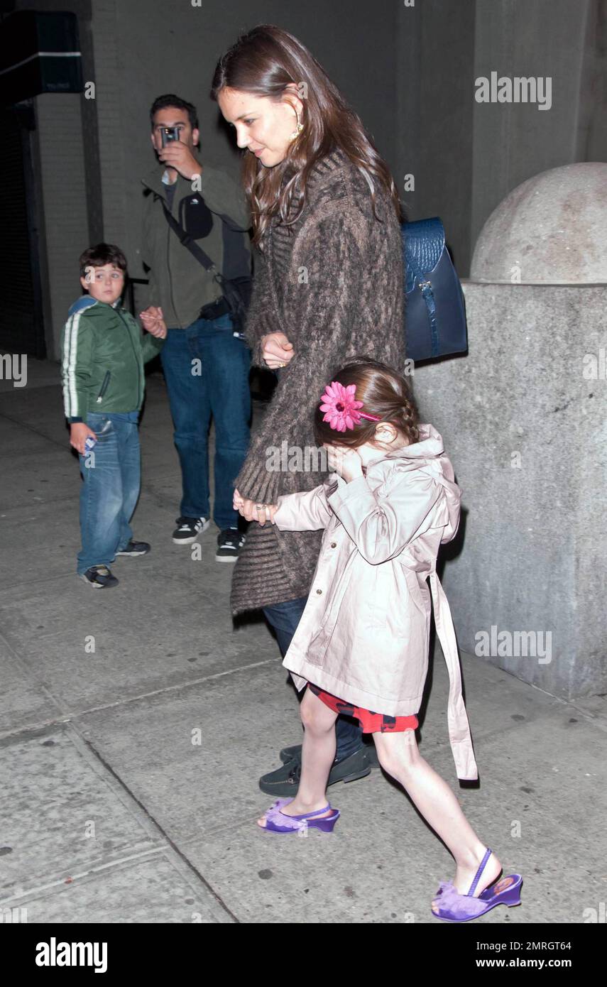 Katie Holmes holds daughter Suri's hand outside their apartment. Little(01)