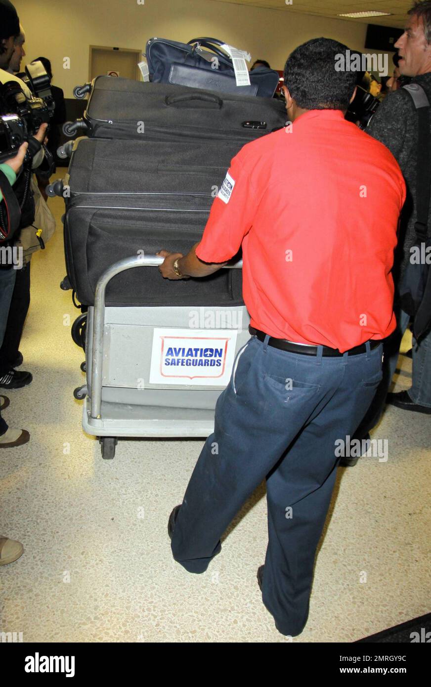 Katie Price (aka Jordan) arrives at LAX with son Harvey in tow after a