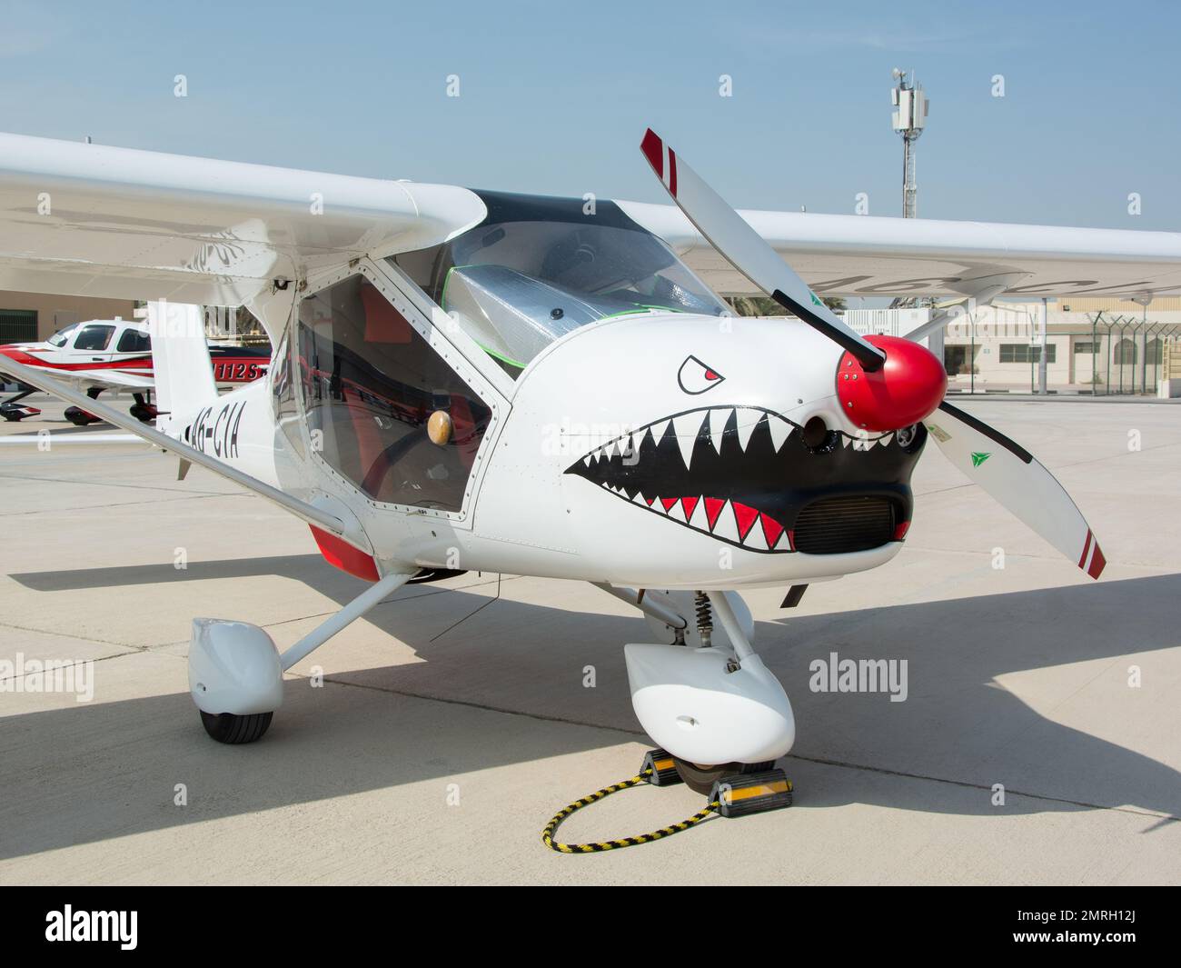 A closeup of the Aeroprakt A32 with a painted shark face in front in Abu Dhabi Air expo 2022 Stock Photo