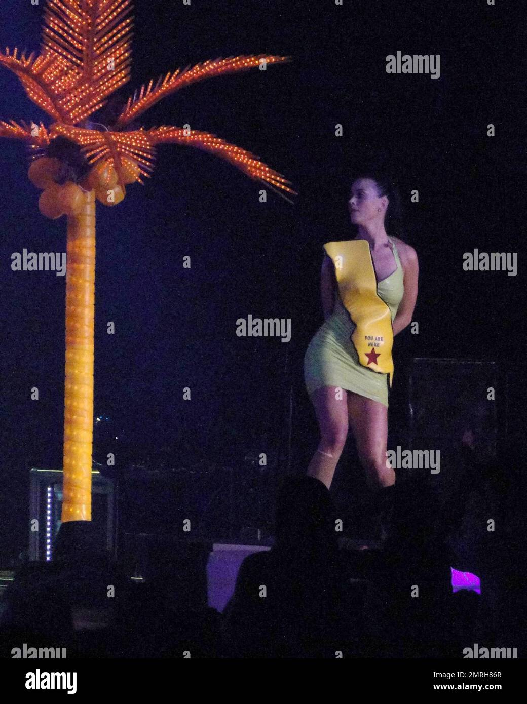 International singer-songwriter Katy Perry performs live at Atlantis Paradise Island in the Grand Ballroom.  Perry performed to Atlantis guests wearing a lime green rubber dress adorned with a yellow map  of what appeared to be California State and a 'you are here' red star.   In true Perry style the stage was decked out with Neon Palm Trees and bouncing beach balls for the crowd.  Perry releases her new album 'Teenage Dream' in August which features her top ten single 'California Gurls' which is the fastest rising single to Top 10 radio in over four years.  Bahamas  7/17/2010 Stock Photo