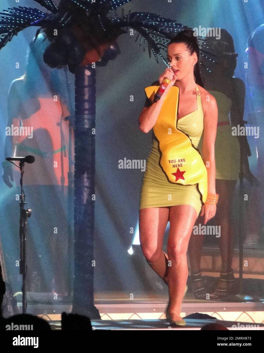 International singer-songwriter Katy Perry performs live at Atlantis Paradise Island in the Grand Ballroom.  Perry performed to Atlantis guests wearing a lime green rubber dress adorned with a yellow map  of what appeared to be California State and a 'you are here' red star.   In true Perry style the stage was decked out with Neon Palm Trees and bouncing beach balls for the crowd.  Perry releases her new album 'Teenage Dream' in August which features her top ten single 'California Gurls' which is the fastest rising single to Top 10 radio in over four years.  Bahamas  7/17/2010 Stock Photo