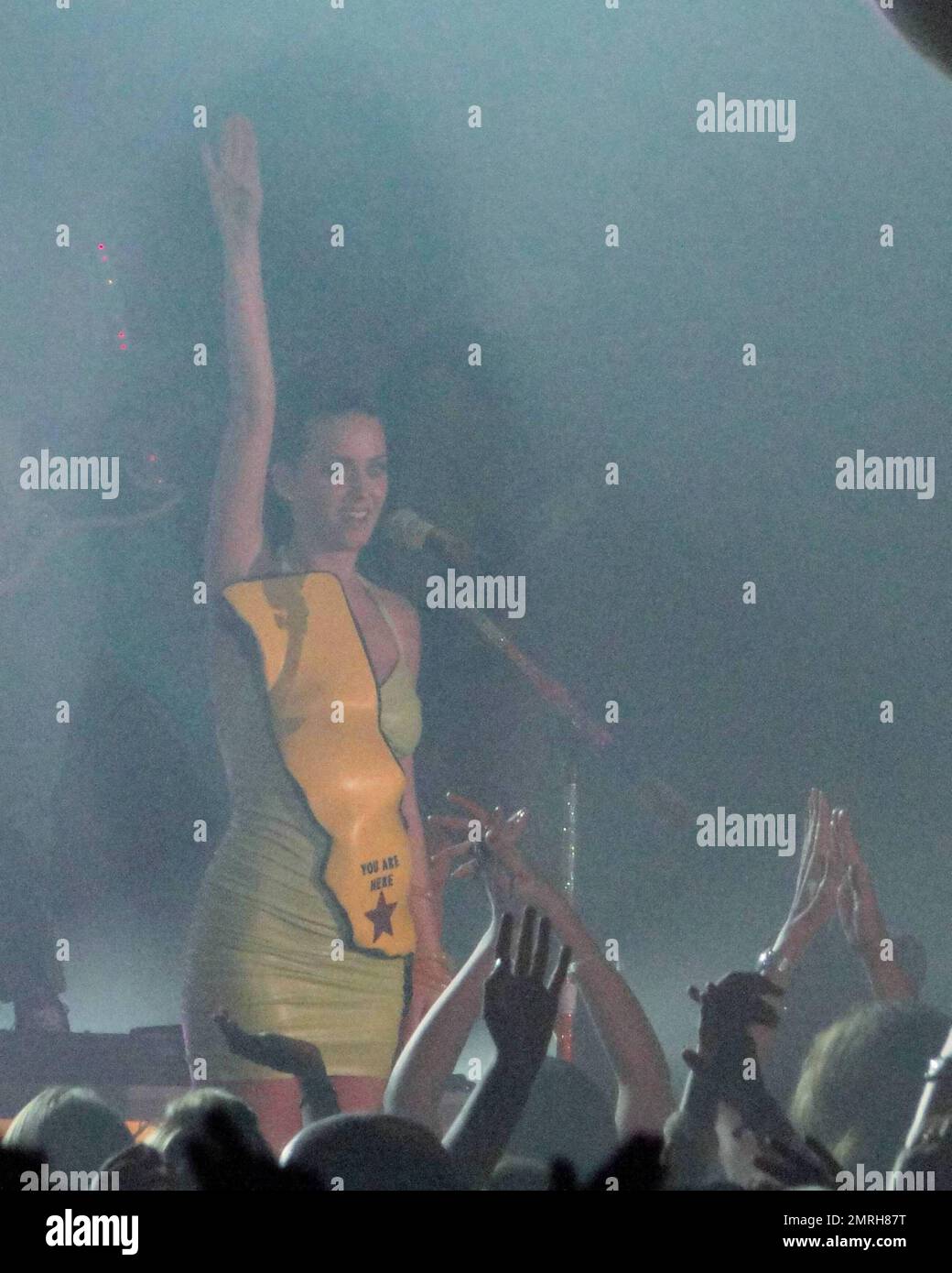 International singer-songwriter Katy Perry performs live at Atlantis Paradise Island in the Grand Ballroom.  Perry performed to Atlantis guests wearing a lime green rubber dress adorned with a yellow map  of what appeared to be California State and a 'you are here' red star.   In true Perry style the stage was decked out with Neon Palm Trees and bouncing beach balls for the crowd.  Perry releases her new album 'Teenage Dream' in August which features her top ten single 'California Gurls' which is the fastest rising single to Top 10 radio in over four years.  Bahamas  7/17/2010   . Stock Photo