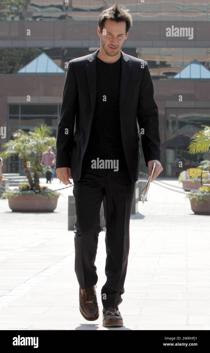EXCLUSIVE!! Actor Keanu Reeves wears all black paired with some clunky