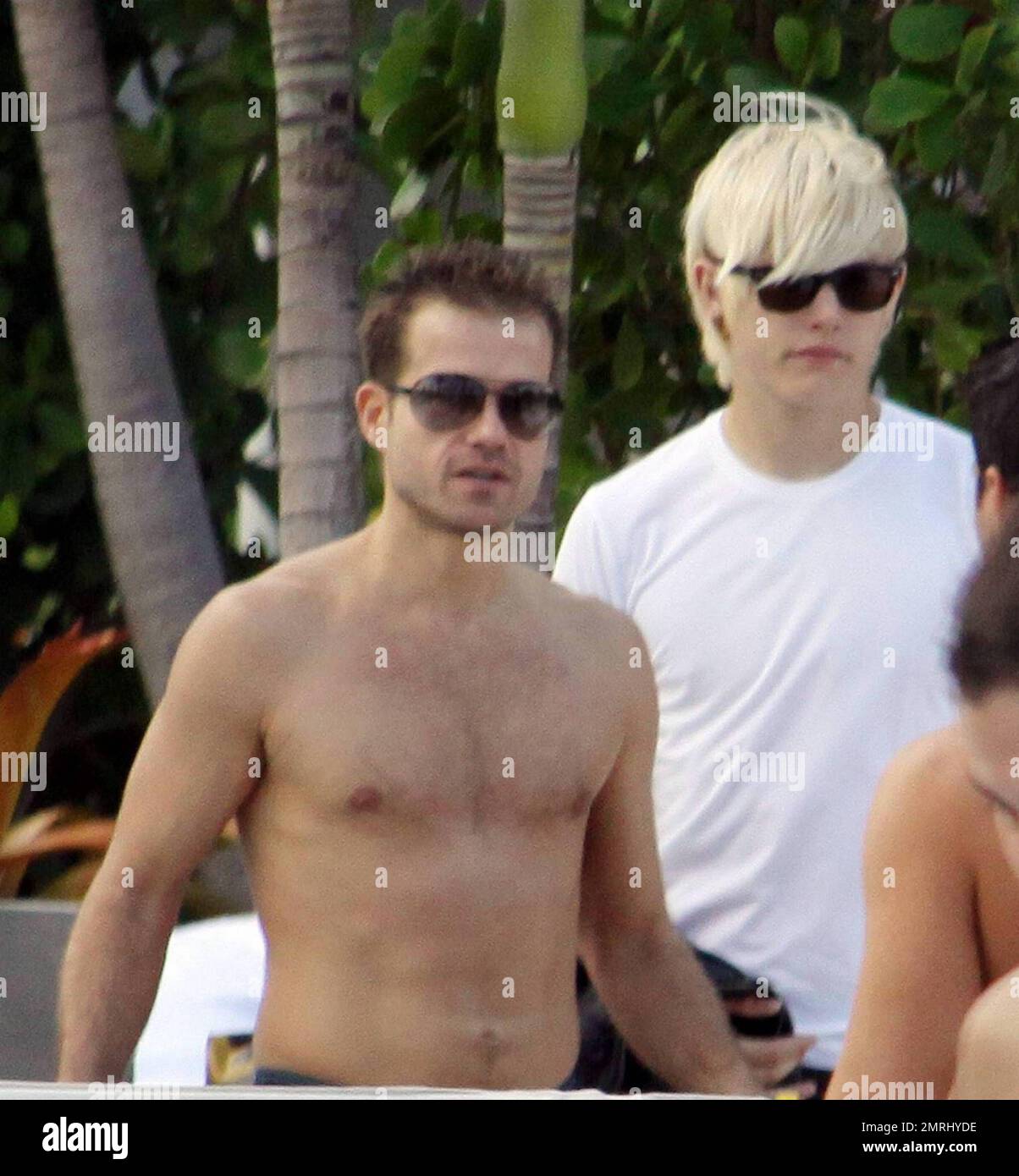 Kelly Osbourne chills out in a cabana poolside with fiance Luke Worrall ...