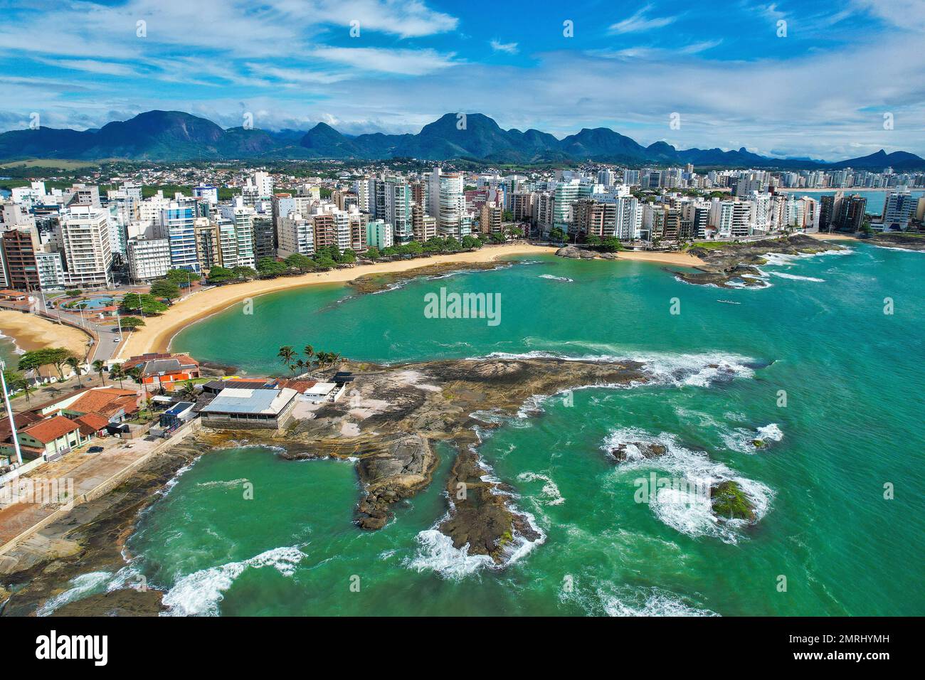 An aerial of the Areia Preta beach in Guarapari town In Brazil with alongside the blue calm ocean Stock Photo