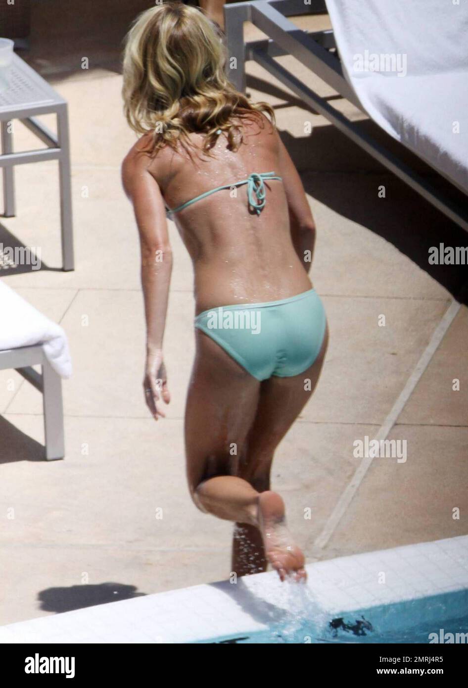 Exclusive!! Kelly Ripa takes a refreshing dip in the pool after filming Live With Regis And Kelly at the Fontainbleu Miami Beach, FL, 05/05/09 Stock Photo photo