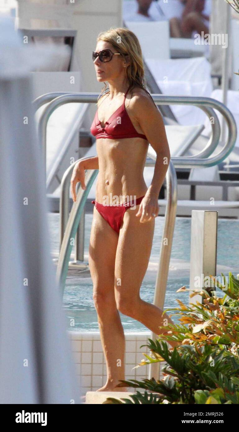 Exclusive!! Kelly Ripa shows off her toned physique in a teeny red bikini  as she relaxed at the pool of an exclusive Miami hotel with her husband  Marc Consuelos and children Michael,