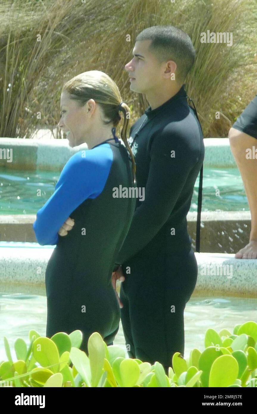 Exclusive!! US TV Show host Kelly Ripa spends a morning at the Miami  Seaquarium with her family. Ripa slipped into a wetsuit and filmed a  segment of the show at Dolphin Harbor