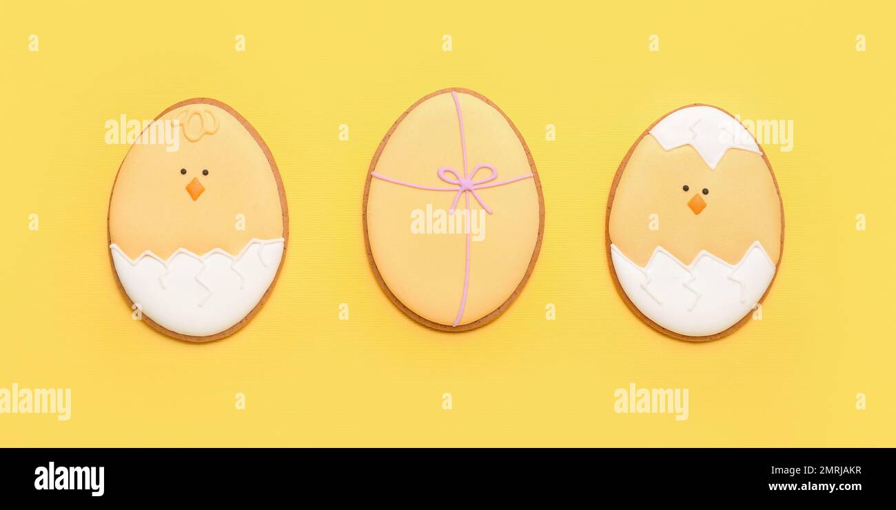 Beautiful Easter cookies on yellow background Stock Photo