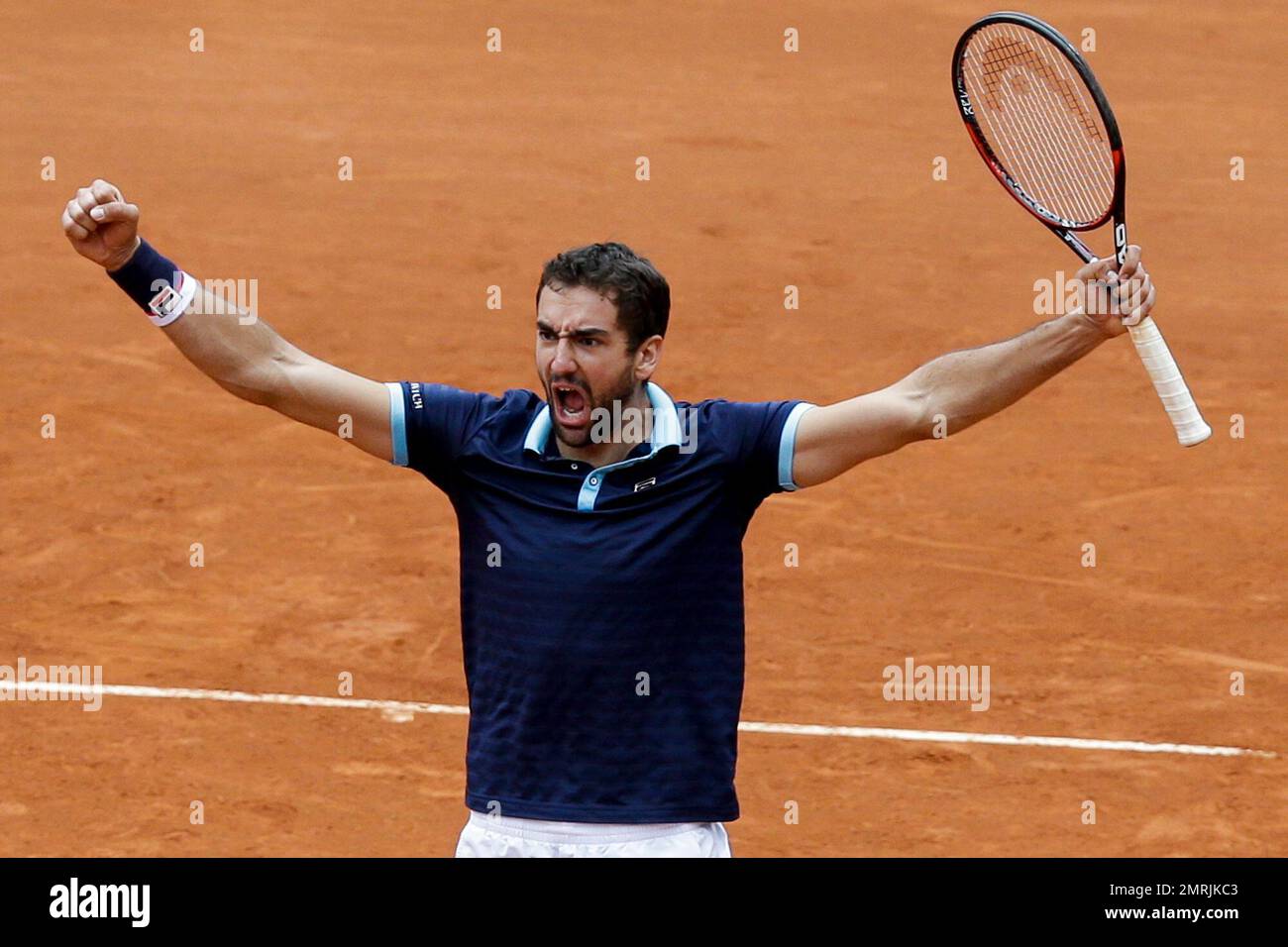 Croatia's Marin Cilic celebrates defeating Colombia's Juan Sebastian Cabal  and Alejandro Falla during their Davis Cup World Group play-offs doubles  tennis match at the Santamaria Bullring in Bogota, Colombia, Saturday,  Sept. 16,