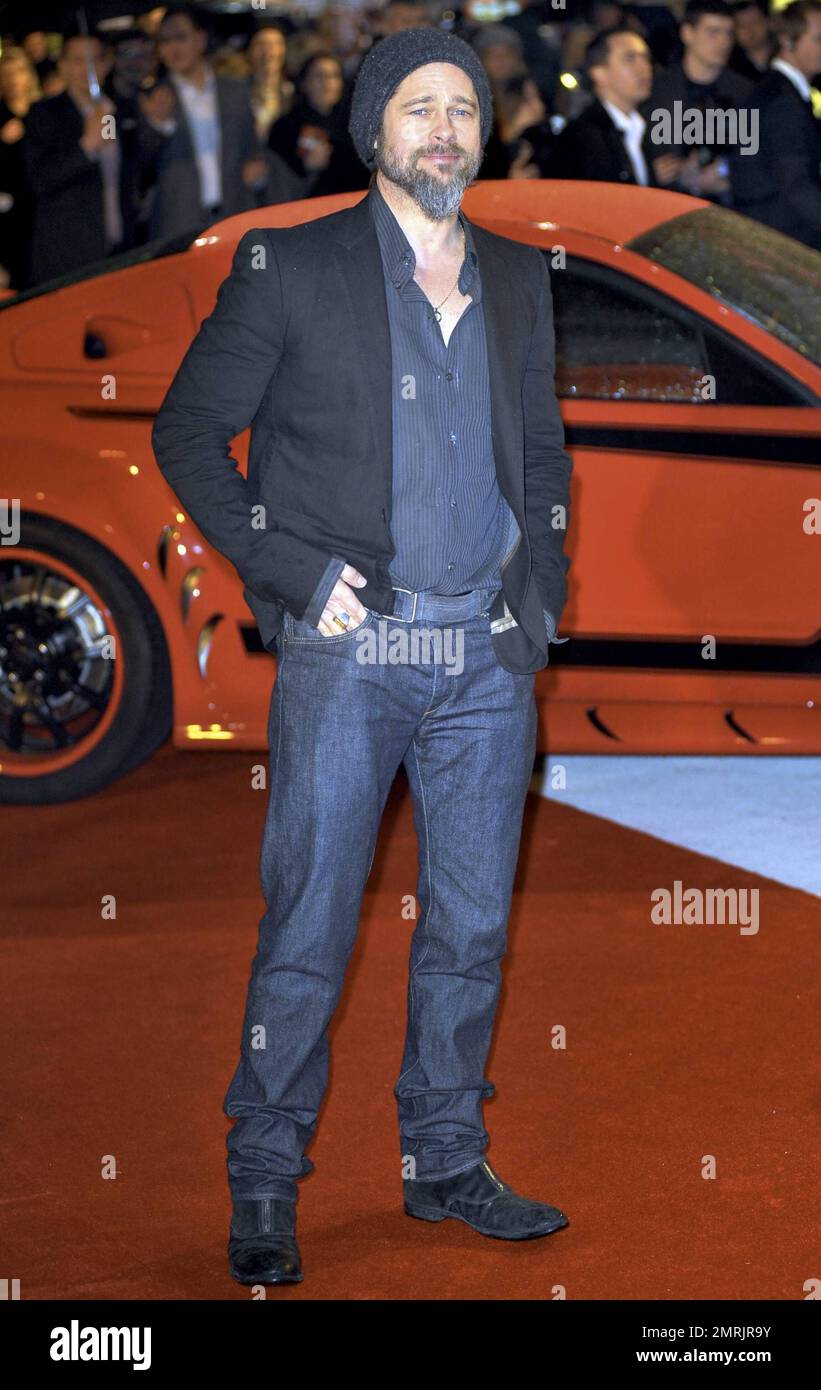 Brad Pitt looks scruffy in his beard and moustache at the premiere of ...