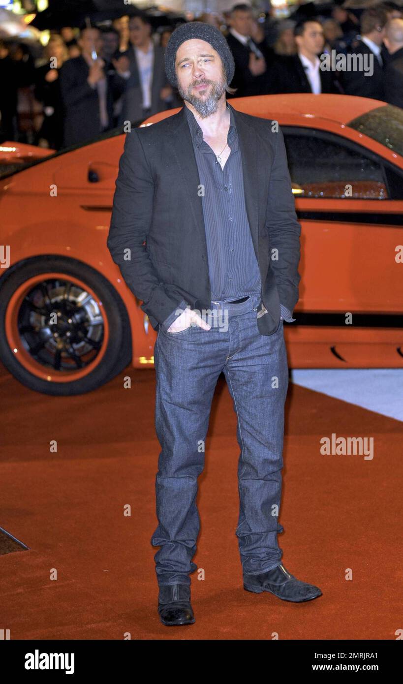 Brad Pitt looks scruffy in his beard and moustache at the premiere of ...