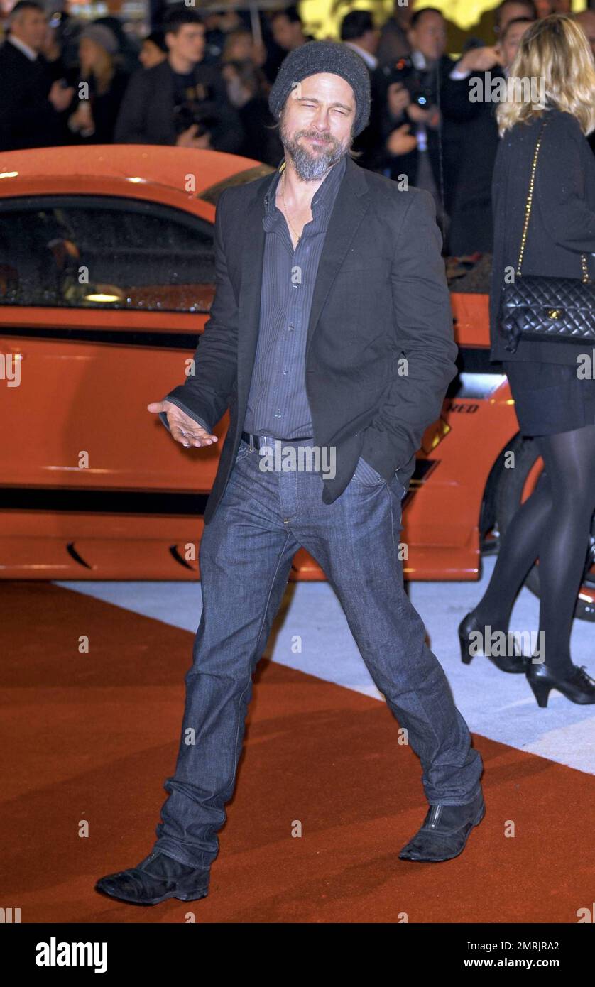 Brad Pitt looks scruffy in his beard and moustache at the premiere of ...