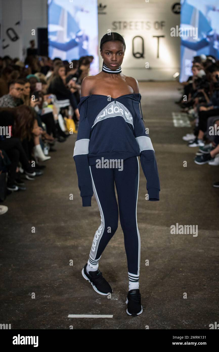 A model wears a creation from the collection Adidas x JD Sports Streets of EQT Spring Summer 2018 during their runway show at London Fashion Week in London Friday Sept. 15 2017. Photo by