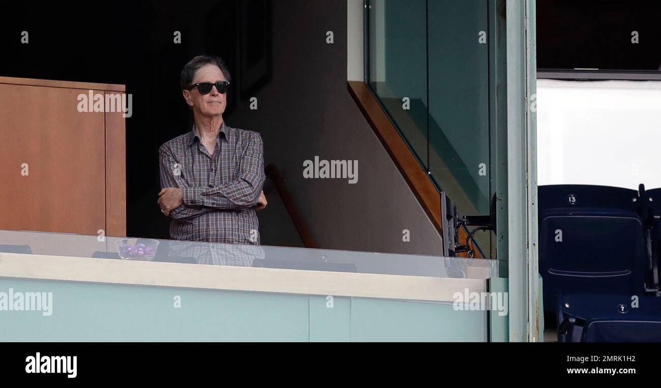 Boston Red Sox owner John Henry watches play from his box a baseball ...