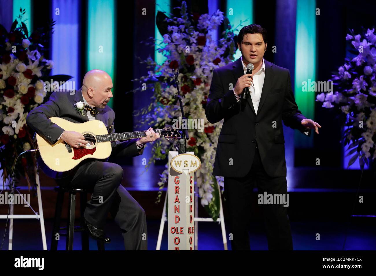 Cody Ray Slaughter, right, performs during a memorial service for 