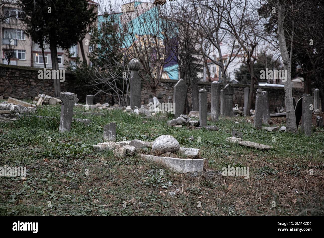 Broken tombstone was left on the grave. It is seen that the 400-year-old historical cemetery in Kadikoy is neglected. The Ayrilik Cesme Cemetery, which is the last part of the Karacaahmet Cemetery in Istanbul Uskudar and contains the graves of the names who served in the Ottoman Palace, has turned into ruins. It is known that the burial process in the cemetery, where the first burials were made 400 years ago, continued until the beginning of the 20th century. The cemetery, where most of the tombstones were destroyed, some of the heads fell off, and in some places the stones were planted collec Stock Photo