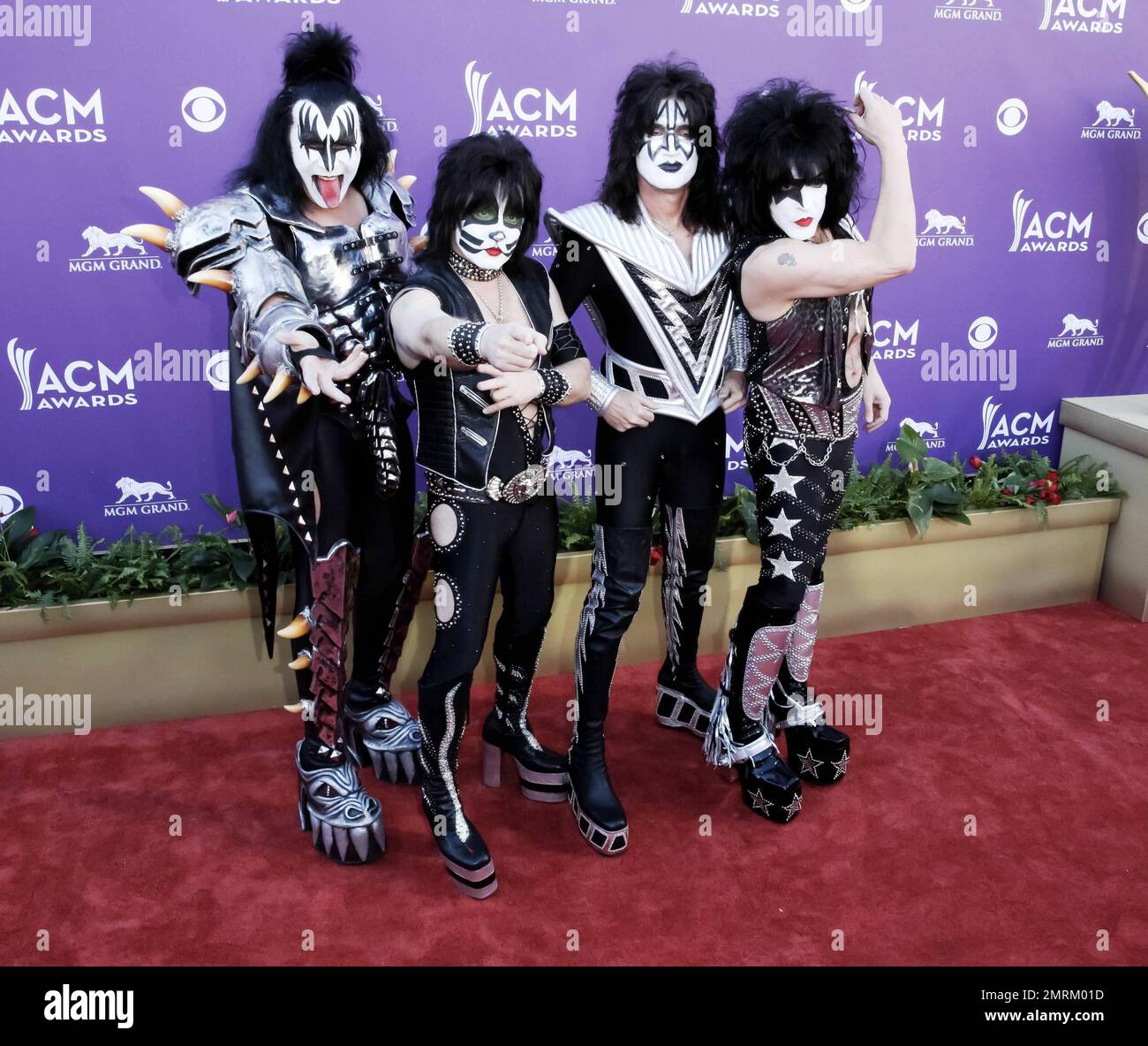Gene Simmons, Eric Singer, Tommy Thayer and Paul Stanley of the metal band 'Kiss' arrives at the Academy of Country Music Awards held at the MGM Resort & Casino. Las Vegas, NV. 1st April 2012. Stock Photo