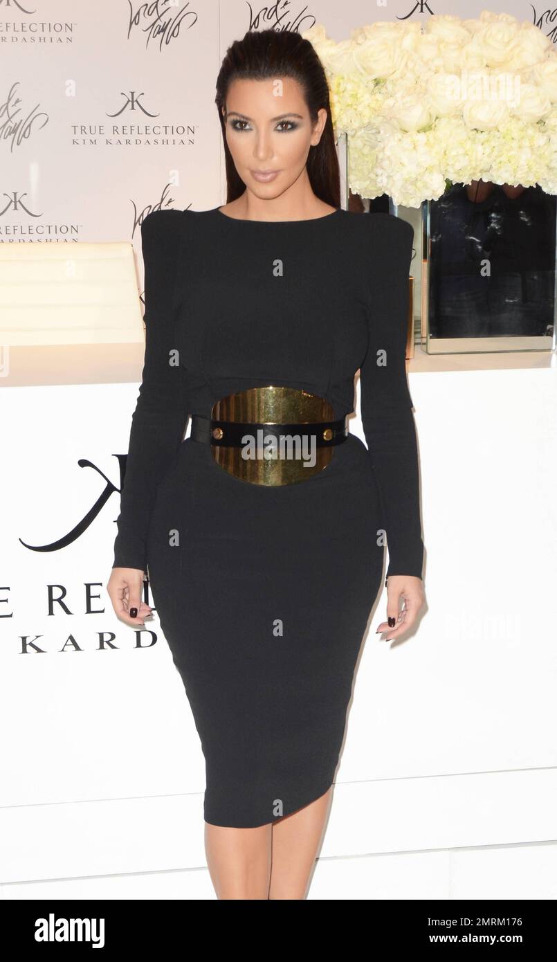 Reality star Kim Kardashian wears a black dress with a wide black belt and black high heels at the 2012 'Fashion's Night Out' at Lord and Taylor in New York, NY. 6th Reality star Kim Kardashian wears a black dress with a wide black belt and black high heels at the 2012 'Fashion's Night Out' at Lord and Taylor in New York, NY. 6th