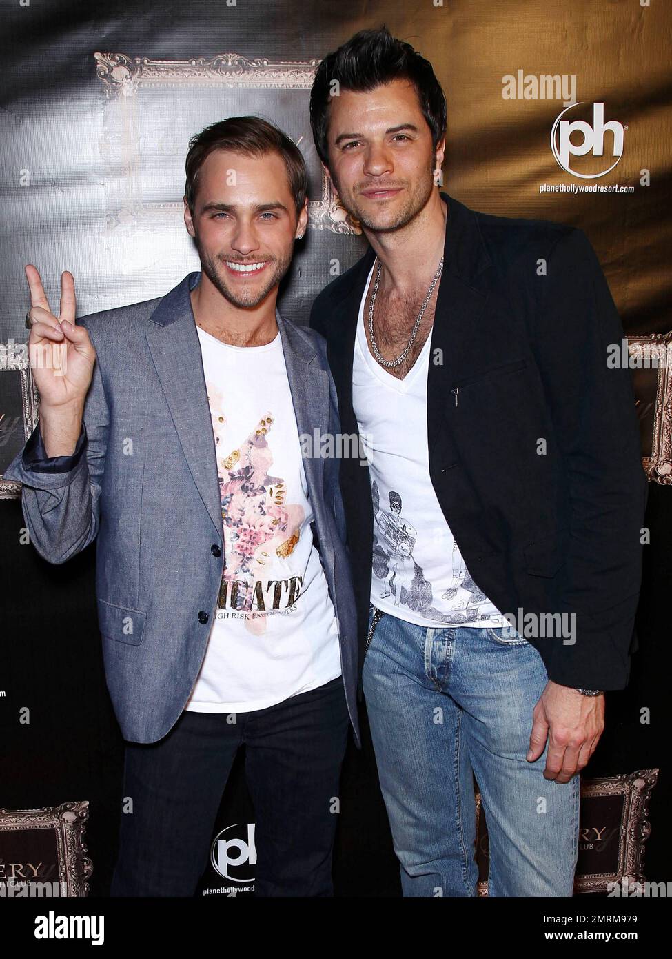 Josh Strickland (L) poses for photographers at Gallery Nightclub inside