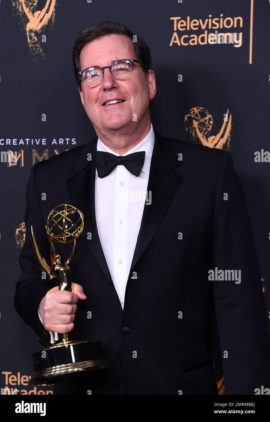 David Rubin poses in the press room with the award for outstanding