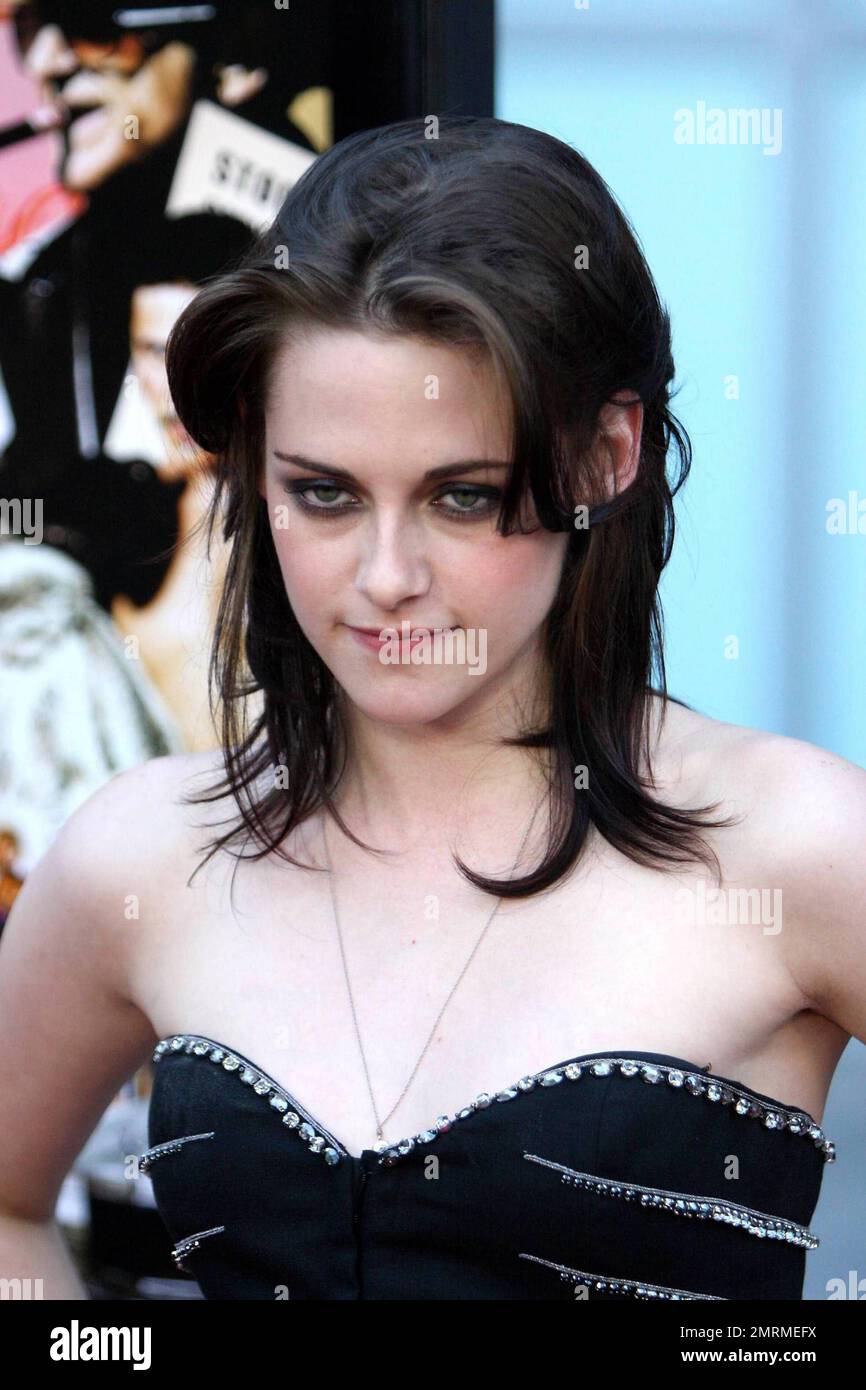 Kristen Stewart attends the Los Angeles premiere of LOVE RANCH. Sporting a black dress and matching nail polish, Kristen seems still to be uncomfortable on the red carpet. The actress was also wearing a simple gold band on her left hand next to her wedding ring finger. Recent reports are that her beau Robert Pattinson is ready to pop the question. Los Angeles, CA. 6/23/10. Stock Photo